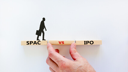 SPAC vs IPO symbol. Blocks with words 'SPAC, special purpose acquisition company' and 'IPO, initial...