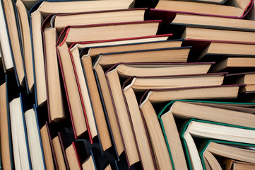 Obraz premium Books open in a pile. Background from books of different colors 