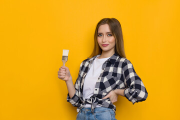 Confident Young Woman Is Posing With Paintbrush