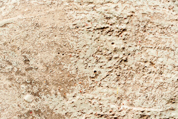 Texture of a concrete wall with cracks and scratches which can be used as a background