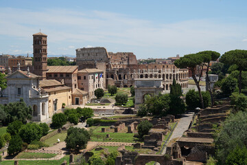 Obraz premium Ancient Roman Forum and Colosseum aerial panoramic view, heart of Roman Empire, famous tourist forum romanum landmark, Rome, Italy