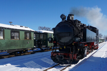 A steam train at the station in Radebeul-Ost. It is a narrow gauge steam-hauled railway near Dresden.