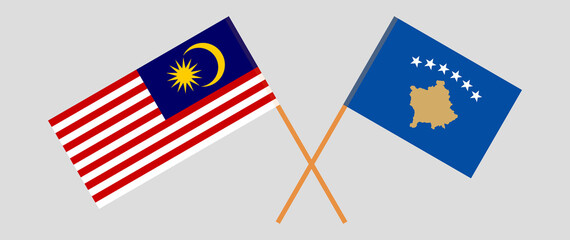 Crossed flags of Malaysia and Kosovo. Official colors. Correct proportion