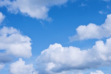 Naklejka na ściany i meble Photo of blue sky and white clouds