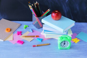 School stationery, books, alarm clock, home learning concept, back to school 