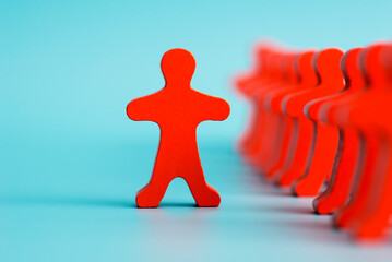 One human figure stands out from the crowd. Talented and skillful suitable candidate. Initiative and active person, leader. Best choice of all. Concept of search for worker