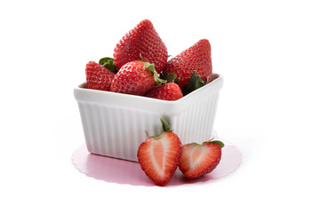 a small white dish of ripe red strawberries isolated on white