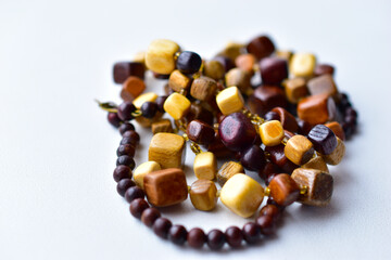 Beautiful wooden beads on a white background