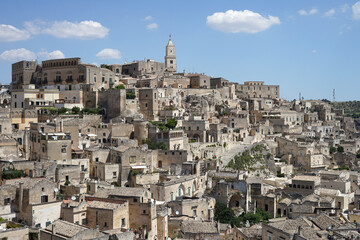 Fototapeta premium Sassi di Matera historic site aerial panoramic cityscape with ancient cave dwellings popular tourist travel place, guided tour concept, Basilicata, Italy