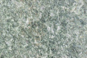 the texture of the emerald-colored granite stone