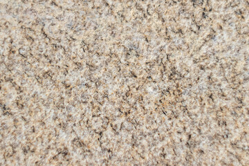 Texture of rough brown stone close-up