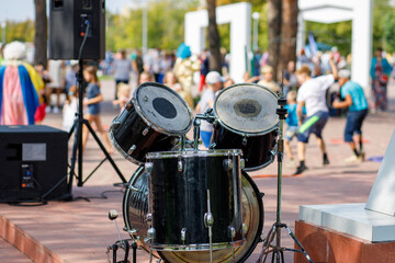 musical instruments drum kit on the background of dancing people