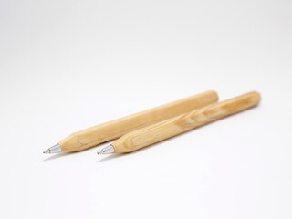 Ecological pens. Wooden pens. Caring for the planet. Renewable material. Natural material. Ecology. Recyclable. Rechargeable.  Item to write. 
Tool for writing and drawing. Isolated white. Clean.