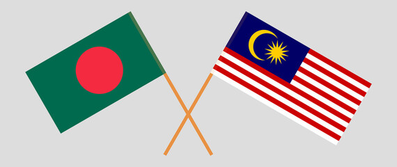 Crossed flags of Bangladesh and Malaysia. Official colors. Correct proportion
