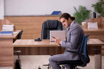 Young businessman employee in bullying concept in the office