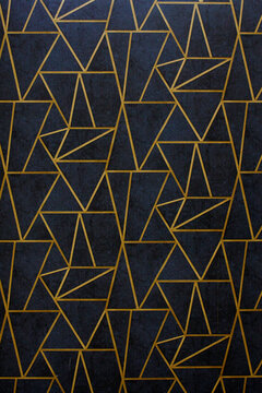 Modern and stylish abstract design poster with golden lines and black geometric pattern.