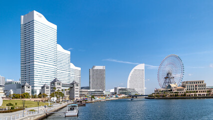 Naklejka premium Ferris wheel at cosmo world fun park at minato mirai , Yokohama is the third biggest city in Japan.