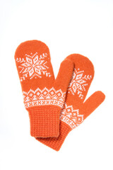 Warm woolen knitted mittens isolated on white background. Orange