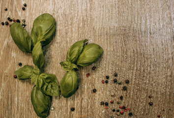 Basil leaves and sprinkled peppercorns