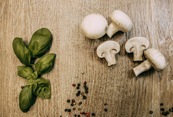 Basil leaves and sliced mushrooms