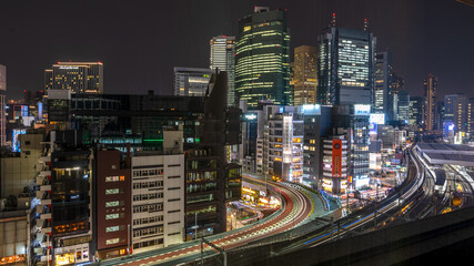 Fototapeta na wymiar Tokyo urban skyscraper skyline rooftop view at night, Japan.