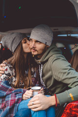 Young happy couple. Bride and groom. A family. Relations. Outdoor picnic in the forest.