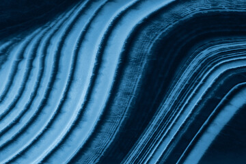 closeup texture with agate blue light and dark lines