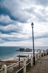 Cromer, Norfolk, UK &ndash; July 25 2020. An editorial photo of a view of the Victorian pier in the Norfolk seaside town of Cromer captured from the coastal footpath