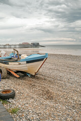 Fototapeta na wymiar Cromer, Norfolk, UK – July 25 2020. An editorial photo of a view of a close up of the front end of a traditional crab fishing boat on Cromer beach on the North Norfolk coast