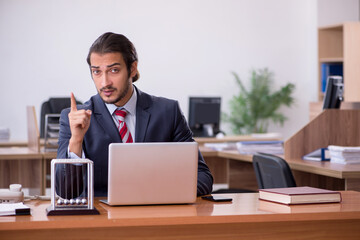 Young man businessman employee sitting in the office