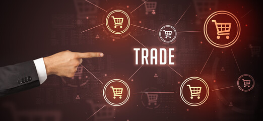 Close-Up of cropped hand pointing at TRADE inscription, online shopping concept