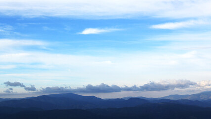 Fototapeta na wymiar Clouds over the blue mountains