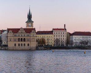 Fototapeta premium view of old prague architecture in prague and vltava river level at sunset in prague 2021