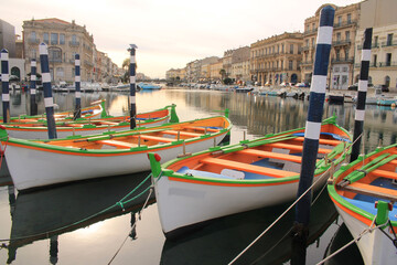 Colorful traditional wooden boats in Sete, a seaside resort and singular island in the Mediterranean sea, it is named the Venice of Languedoc Rousillon, France
