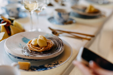 Table setting with vintage tableware and a dessert dish.