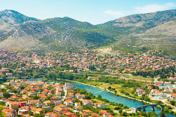 Obraz premium Beautiful sunny summer landscape. Bosnia and Herzegovina, Republika Srpska. View of ancient city of Trebinje from Crkvina Hill