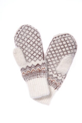 Warm woolen knitted mittens isolated on white background