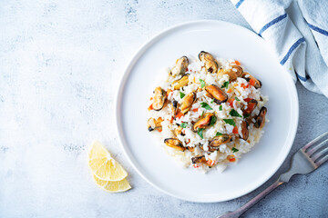 Mussel rice with pepper and parsley in a plate