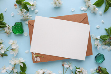 postcard mockup. floral frame of spring flowers, envelope and white blank for text 