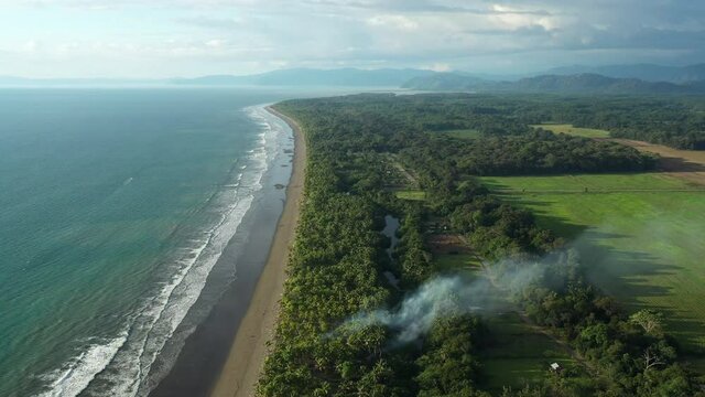 Costa Rica coastline aerial view of Zancudo beach ocean with palm trees
