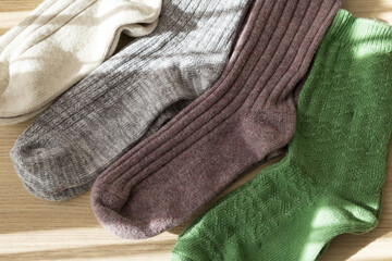 Fototapeta na wymiar colorful socks on the wooden background.
