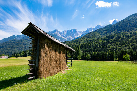 Kozolec - slovenian typical hayrack with beautiful panorama of Julian Alpes, Slovenia