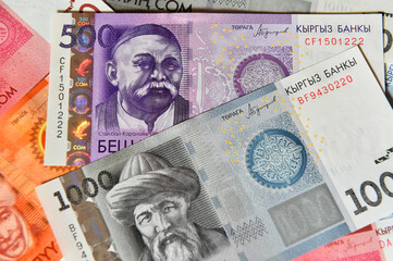 a current money of kirguistan with selective focus