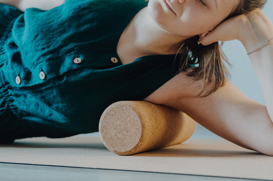 Upper Body Details Of Woman Rolling Lower Armpit On A Cork Massage Roller To Release Tension In Side Body Muscles. Concept: Self Care Practices At Home, Sustainable Props, Physical Health