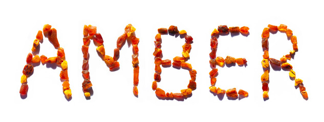 Amber letters word made with Shiny yellow gold stones isolated on white . For cosmetic or medicine articles design, mineralogy websites, natural science museum wall chart.