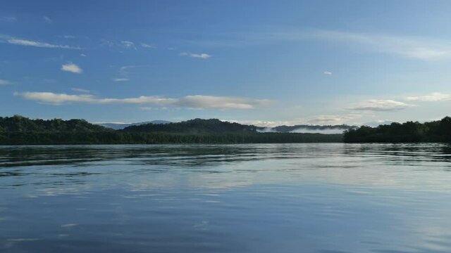 Glassy calm water Golfe Dulce Costa Rica early morning