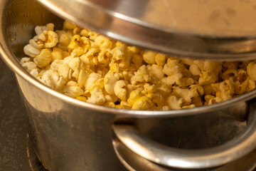 from corn kernels to popcorn in the kitchen pot