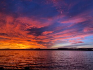 Sunset over the Oslofjord on the first day of 2020. Contrasting orange, dark and light blue colours.