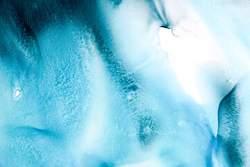 Alcohol ink colors translucent. Abstract blue marble texture background. Design wrapping paper, wallpaper. Mixing acrylic paints. Modern fluid art. Alcohol Ink Pattern, ethereal graphic design
