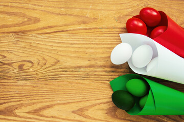 Happy Easter holiday card, Easter eggs as the color of the Italian flag - green, white, red	
